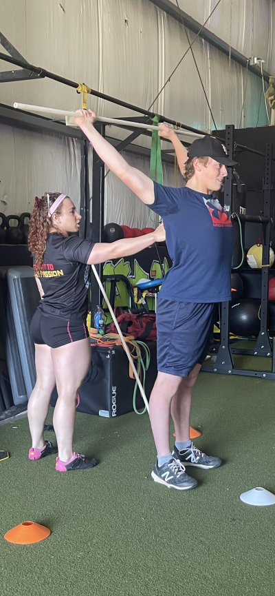 Dr. Blake Tobin, DPT with a HS Baseball Player