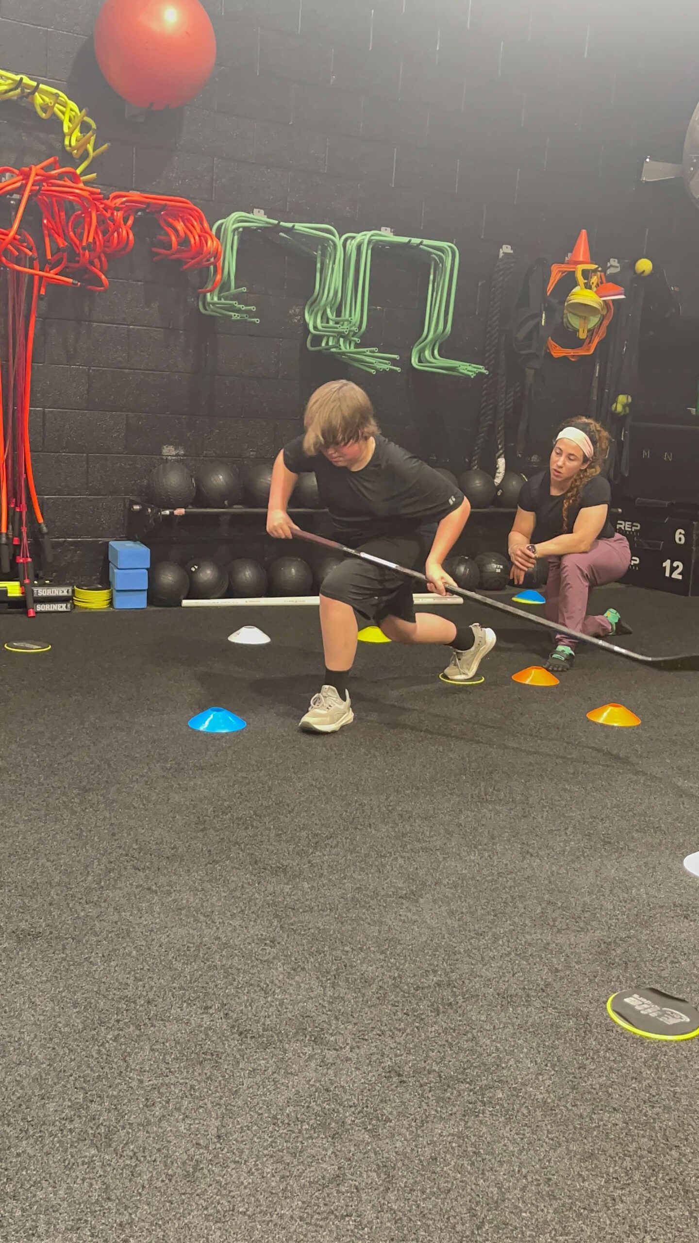 Dr Blake training a Middle School Hockey player